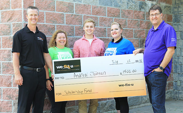 4 people holding the large wefixu scholarship cheque