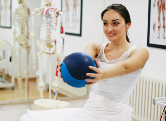 Physiotherapy exercise with medicine ball